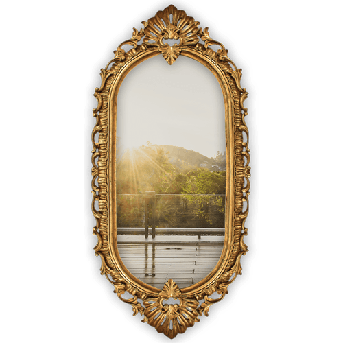 Scenic view through ornate mirror frame